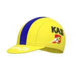 Image of a yellow cycling cap with a central blue stripe, reminiscent of the retro charm of the Womens KAS Canal Retro Cycling Jersey Set. The cap showcases KAS and 10 CANAL logos in black and red on the side and brim, evoking classic cycling style.