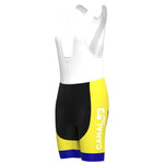 The Womens KAS Canal Retro Cycling Jersey Set, showcased on a mannequin, highlights a white top with a black bottom and yellow side panels, featuring CANAL and the number 20, complemented by blue-banded shorts.