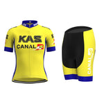The Womens KAS Canal Retro Cycling Jersey Set, adorned with KAS and CANAL 10 logos, enhances your ride with style. The short-sleeve jersey has a front zipper and blue accents, while the black shorts feature yellow and blue details for a classic look.