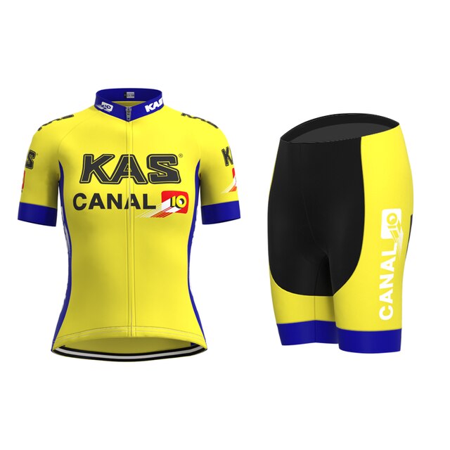 The Womens KAS Canal Retro Cycling Jersey Set, adorned with KAS and CANAL 10 logos, enhances your ride with style. The short-sleeve jersey has a front zipper and blue accents, while the black shorts feature yellow and blue details for a classic look.