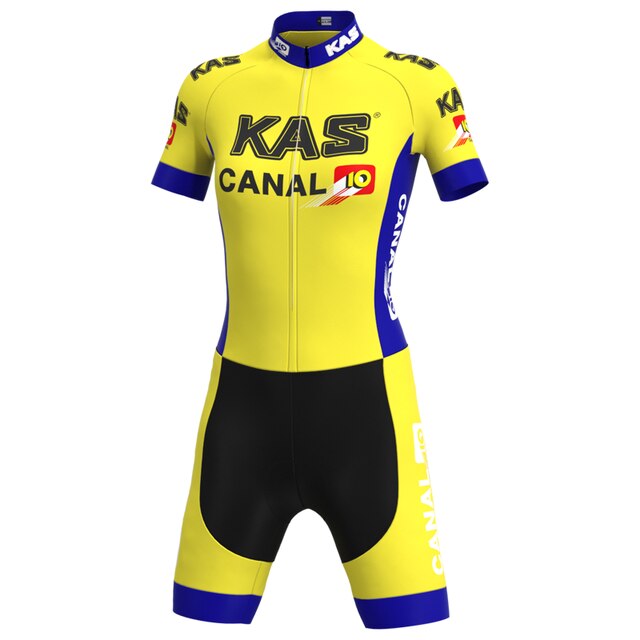 The Womens KAS Canal Retro Cycling Jersey Set features a yellow jersey and shorts adorned with KAS and CANAL 10 logos in black and white, plus blue accents on the sleeves and leg hems, blending nostalgic style with modern flair.