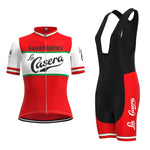 The Womens La Casera-Bahamontes Retro Cycling Jersey Set features a short-sleeve red jersey with white and green stripes displaying Bahomontes and La Casera, paired with black bib shorts that have bold red sides featuring the white La Casera logo.