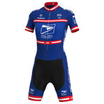 The Womens US Postal Service Jersey Set is a blue and black short-sleeved cycling suit with red and white accents. It features postal service-inspired logos, a zippered front, and breathable shorts for optimal comfort.