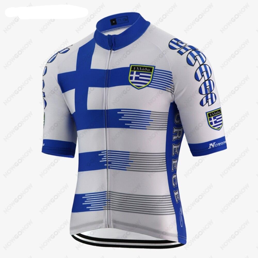 The Greece Cycling Jersey features a blue and white design with a bold Greek flag motif, crafted from lightweight polyester for performance. GREECE is printed on the sleeves and sides in blue capitals, with a badge of a shield and cross on the front.