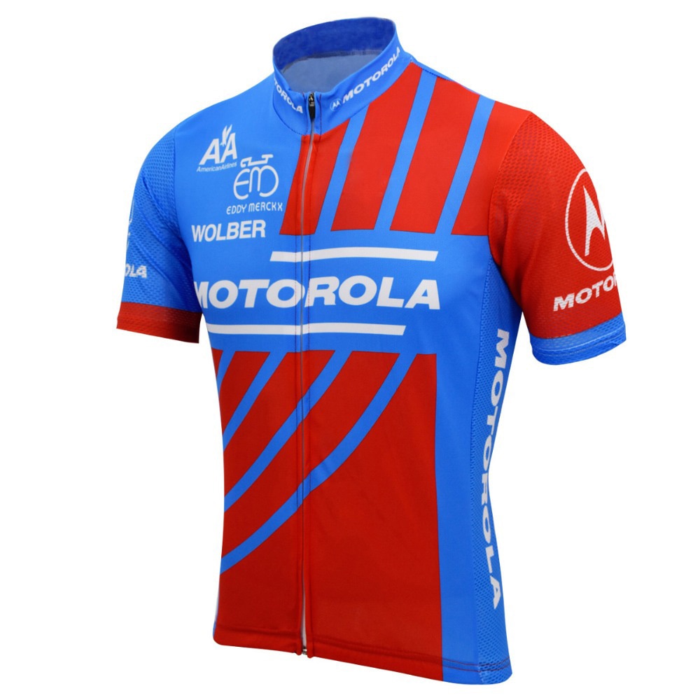 The Motorola Retro Cycling Jersey features a zip front, red and blue short sleeves with MOTOROLA in white, vertical and diagonal stripes, and various sponsor logos on the chest and sleeves, capturing the essence of the Motorola Cycling Team.
