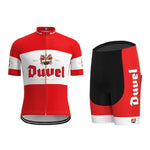 The Duvel Beer Retro Cycling Jersey Set includes a red and white jersey with the iconic Duvel logo and crest, featuring short sleeves and a full front zipper. The coordinating black and red breathable shorts also display the logo on the side.