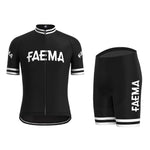 The Faema 1955 Retro Cycling Jersey Set features a black jersey and shorts with FAEMA in bold white letters. The jersey has short sleeves, a front zipper, and white cuffs, while the fitted shorts include white leg bands, combining retro style with breathable comfort.