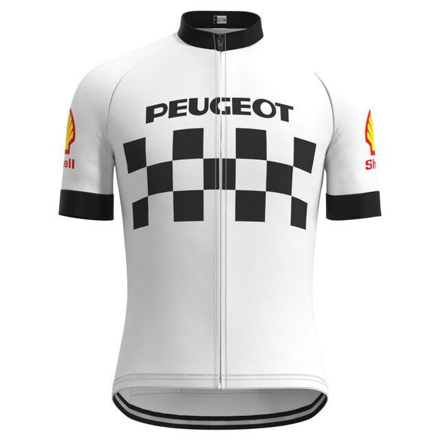 The Classic 1960s Peugeot Retro Cycling Jersey Set features PEUGEOT above a checkerboard pattern, red and yellow Shell logos on the sleeves, and black collar and trims, capturing Eddy Merckxs era with timeless style.
