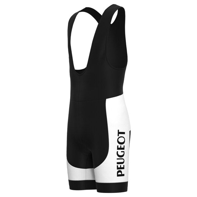 The Classic 1960s Peugeot Retro Cycling Jersey Set includes black and white bib shorts with PEUGEOT on the right leg, evoking a vintage cycling look, complete with shoulder straps and minimalist design for fans of Eddy Merckxs era.