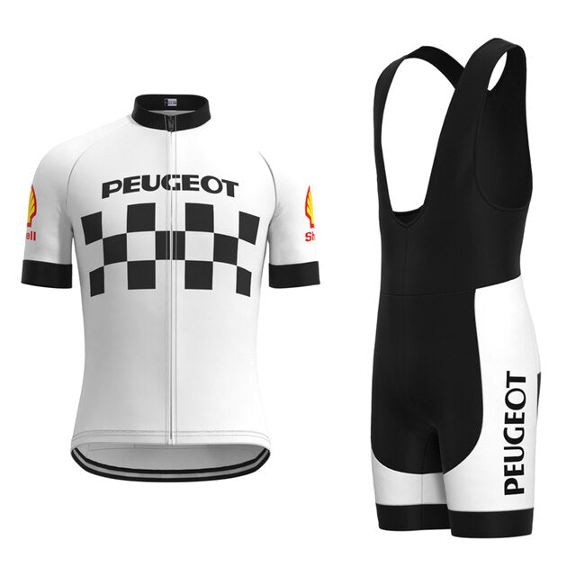 The Classic 1960s Peugeot Retro Cycling Jersey Set includes a white jersey with a black checkerboard and Shell logos on the sleeves, paired with black and white bib shorts featuring Peugeot on the side—reminiscent of what Eddy Merckx might have worn.