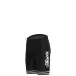 The Paris-Roubaix Retro Cycling Jersey Set features black cycling shorts with a cursive logo on the side and two white stripes near the leg openings, tailored for performance cycling. Presented against a white backdrop, it combines style and function for avid cyclists.