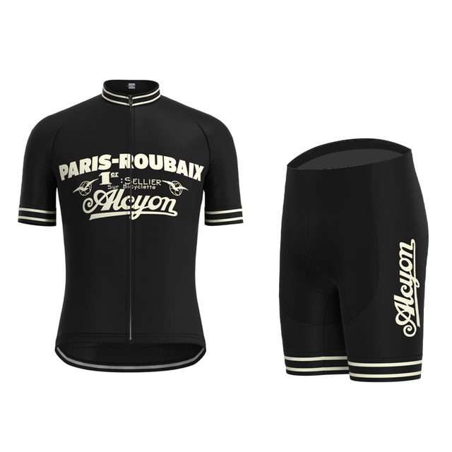 The Paris-Roubaix Retro Cycling Jersey Set boasts vintage style with white text and stripes. Designed for performance, the jersey displays PARIS-ROUBAIX and Alcyon, while the black shorts feature a gel seat pad for enhanced comfort.