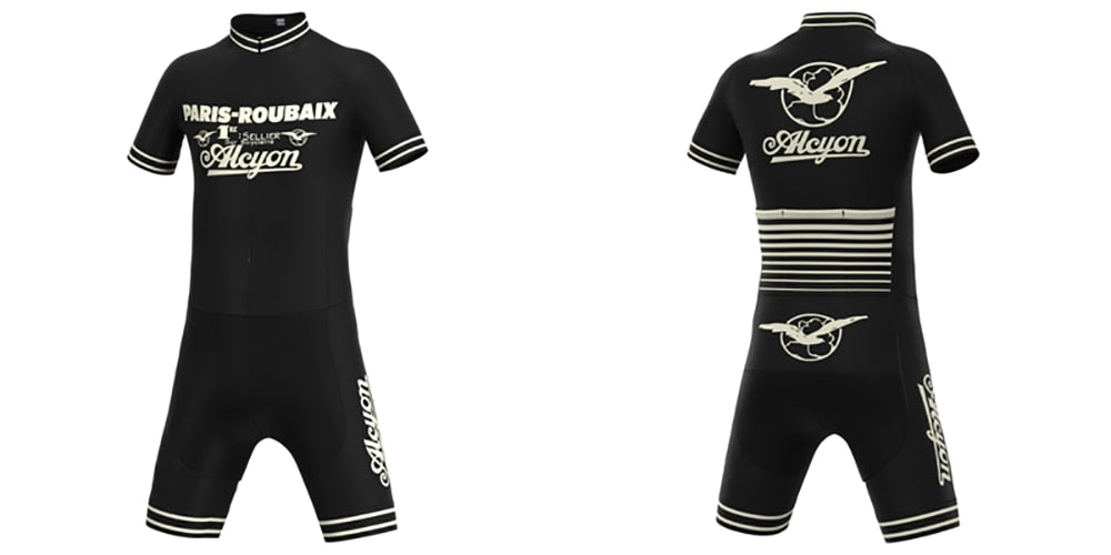 The Paris-Roubaix Retro Cycling Jersey Set is a black kit with white text and logos, featuring a short-sleeve zippered jersey with striped back and bird logo. Matching shorts include a breathable gel seat pad for optimal performance.