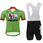 The Alfa Lum Legnano Retro Cycling Jersey Set includes a green jersey with red and white accents, iconic logos, and black bib shorts made from breathable fabric. The shorts feature white straps and side text, offering a stylish and comfortable cycling experience.
