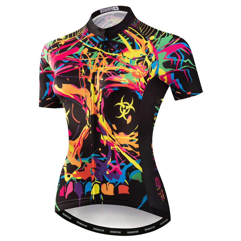 The Womens Jazzy Skull Cycling Jersey is a vibrant, short-sleeve performance top, made from lightweight polyester with abstract neon paint splatters on black and a small biohazard symbol on the chest. Its breathable for comfort and style while cycling.