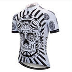 The Oriental Skull Cycling Jersey features a black and white sugar skull design with intricate patterns and bold stripes. Made from lightweight polyester, its sleeves and sides showcase smaller skull motifs, making it ideal for any cycling enthusiast.