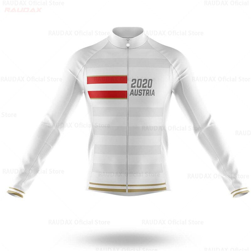 The Austria Long Sleeve Cycling Jersey is a lightweight polyester jersey in white with gray horizontal stripes, red and white chest accents, 2020 Austria in black, a full front zipper, and gold trim on the cuffs and hem.