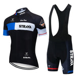 The Strava Cycling Jersey Set includes a lightweight polyester jersey in black and white with blue accents featuring STRAVA, paired with black bib shorts that have a gel seat pad and the STRAVA logo on one leg for added comfort.