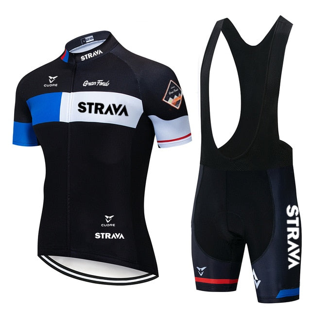 The Strava Cycling Jersey Set includes a lightweight polyester jersey in black and white with blue accents featuring STRAVA, paired with black bib shorts that have a gel seat pad and the STRAVA logo on one leg for added comfort.