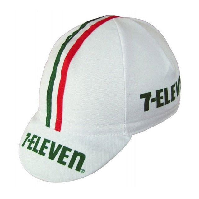 The 7-ELEVEN Retro Cycling Cap features a classic design with green and red stripes over the top, a vintage look. It proudly displays the green logo on both the front and side.