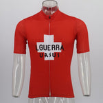 Displayed on a transparent mannequin, the Learco Guerra Ursus Retro Cycling Jersey Red pays homage to the Giro dItalia 1954 with a white cross and L. GUERRA URSUS text on the front. It features a full front zipper and short sleeves, echoing Learco Guerras iconic style.