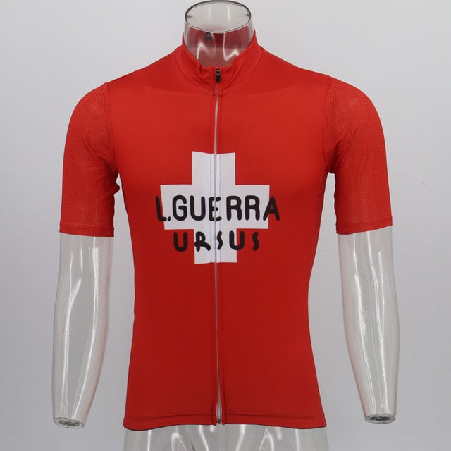 Displayed on a transparent mannequin, the Learco Guerra Ursus Retro Cycling Jersey Red pays homage to the Giro dItalia 1954 with a white cross and L. GUERRA URSUS text on the front. It features a full front zipper and short sleeves, echoing Learco Guerras iconic style.