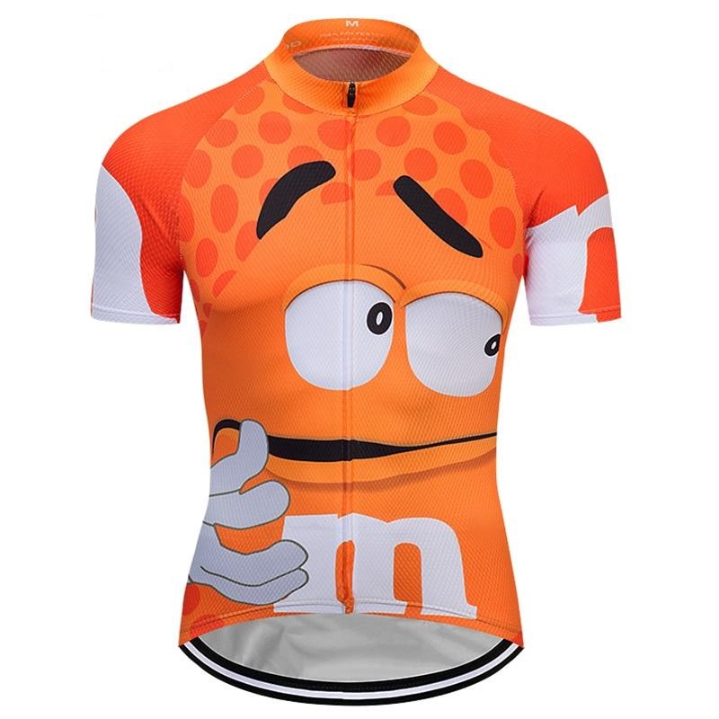 The M&Ms Orange Cycling Jersey is a lightweight polyester jersey featuring a cartoon character with large eyes and a playful expression, giving a thumbs-up. It has a polka dot pattern on top and includes a convenient front zipper.