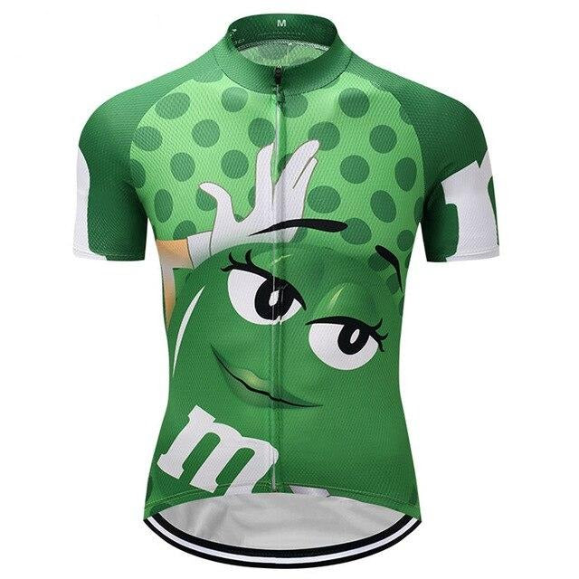 The M&Ms Green Cycling Jersey, adorned with a large-eyed animated green candy character and playful polka dots, is crafted from lightweight polyester for comfort and features a convenient front zipper.