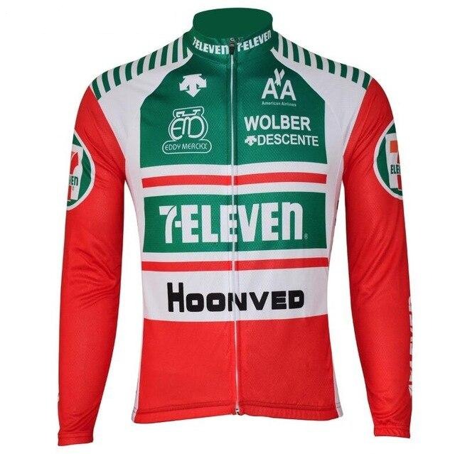 The 7-Eleven Retro Cycling Jersey in bright red, white, and green displays Eddy Merckx bikes and Hoonved logos among others. This fleece jersey includes a full-length zipper, long sleeves, and branding on the front and shoulders for a classic cycling look.