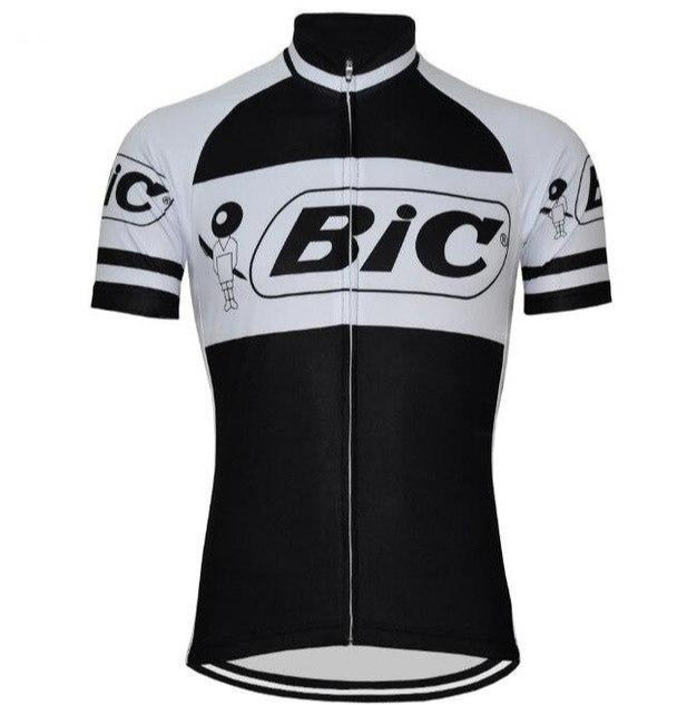 The BIC Black Short Sleeve Retro Cycling Jersey features a classic black and white design, prominently displaying the iconic BIC logo on the front and sleeves. This jersey, with a full-length zipper, pays homage to Jacques Anquetil for a timeless appeal.
