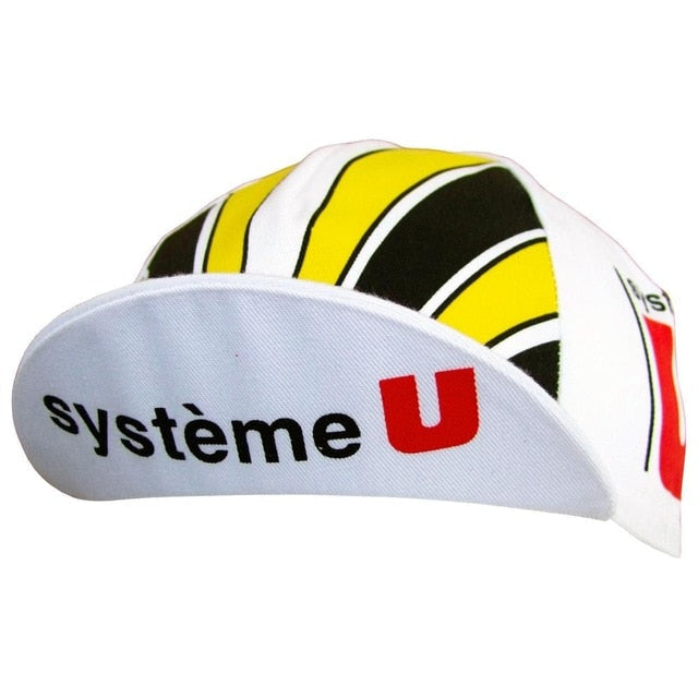 The Systeme U Retro Cycling Cap has a vintage white base with yellow and black patterns, featuring système U in bold black and red text on the brim, encapsulating retro cycling charm.