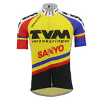 The TVM Verzekeringen Retro Cycling Jersey, featuring a vibrant yellow, blue, red, and black design with TVM Verzekeringen and SANYO logos, is crafted from lightweight polyester. It includes short sleeves and a full front zipper for breathability and performance.