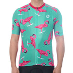 A person wearing the Flamingo Cycling Jersey stands against a teal background with pink flamingos. Made from lightweight polyester, this performance jersey includes a front zipper and short sleeves, with only the torso visible.