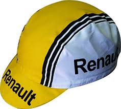 The Renault Gitane Retro Cycling Cap features a classic yellow and white design with Renault printed in black on the front and side, complemented by black stripes on its short brim—an homage to the iconic Renault Gitane era.