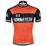 The U.S. Gornatese Retro Cycling Jersey features a vibrant orange and black design, U.S. Gornatese in white on the front, crafted from lightweight polyester with short sleeves and a front zipper for style and functionality.