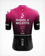 The image features the back of a Ribble Weldtite Huub Cycling Team Jersey Set in pink and black, decorated with RIBBLE, WELDTITE, and HUUB logos, along with other sponsor logos on the sleeves and back, complementing the matching bib shorts.