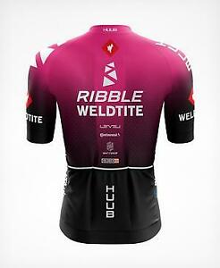 The image features the back of a Ribble Weldtite Huub Cycling Team Jersey Set in pink and black, decorated with RIBBLE, WELDTITE, and HUUB logos, along with other sponsor logos on the sleeves and back, complementing the matching bib shorts.