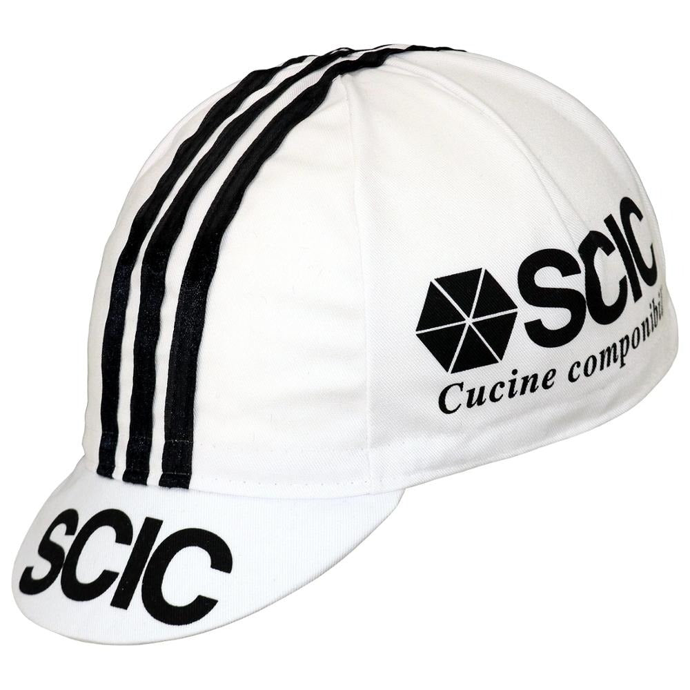 The SCIC Cucine Conponibili Retro Cycling Cap features a white design with three black stripes front to back. SCIC Cucine componibili is on the side, and SCIC is on the brim. Discover more retro cycling caps at vintagecycling.shop for classic style.