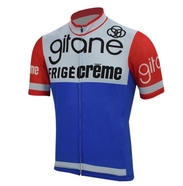 The Gitane Frigecreme Retro Cycling Jersey features a bold red, blue, and white design with the iconic Gitane Frigecrème logo. Inspired by a French pro team, it includes red sleeves with gitan and reflective strips for both style and visibility.
