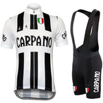 The G.S. Carpano Retro Cycling Jersey Set features a black and white jersey and bib shorts with CARPANO text. Made from lightweight polyester, it boasts vertical stripes and a G.S. Carpano shield with Italian colors on the chest, echoed near the hem of the shorts for a classic look.