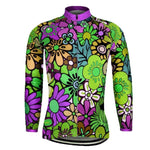 The Womens Long Sleeve Floral Design Cycling Jersey showcases a lively floral print with purple, green, yellow, and pink flowers on a multicolored background. It includes a front zipper, a purple collar, and an optional fleece lining for extra warmth on cooler rides.