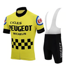 The Peugeot Esso Retro Cycling Jersey Set features a yellow jersey with Cycles Peugeot and Michelin logos, black checkered pattern, and sleeve patches. The black bib shorts highlight the Peugeot logo. Made from lightweight, breathable fabric for true performance in cycling.